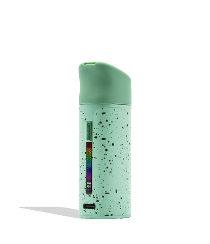 WULF MODS Pocket Mini portable concentrate vaporizer in teal/mint with black spatter pattern details, featuring a vertical rainbow LED indicator light on the side, shown against a plain white background.